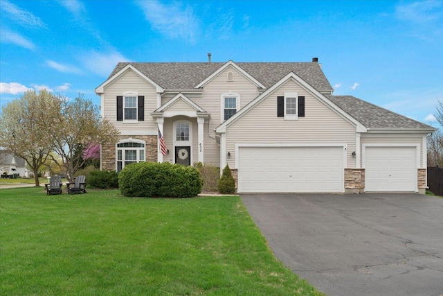 605 Acorn Ct, Antioch, IL 60002 - traditional home featuring stone siding, asphalt driveway, a front lawn, and a shingled roof