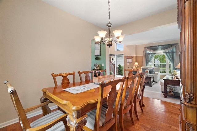 605 Acorn Ct, Antioch, IL 60002 - dining space with a chandelier, light wood finished floors, and baseboards