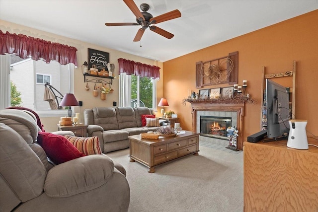 605 Acorn Ct, Antioch, IL 60002 - living area with a fireplace, a ceiling fan, and light colored carpet