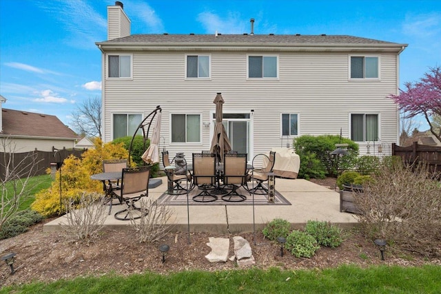 605 Acorn Ct, Antioch, IL 60002 - rear view of house with a patio area and a chimney