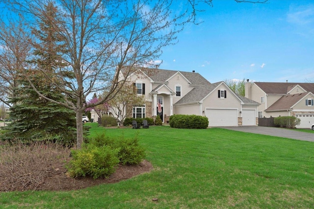605 Acorn Ct, Antioch, IL 60002 - traditional-style home with a garage, asphalt driveway, and a front lawn