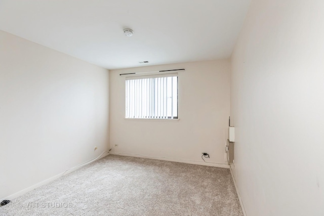 5 E Carriageway Dr Unit 209, Hazel Crest, IL 60429 - empty room featuring light colored carpet, baseboards, and a smoke detector