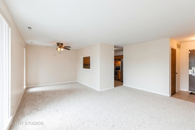 5 E Carriageway Dr Unit 209, Hazel Crest, IL 60429 - unfurnished room featuring light colored carpet, ceiling fan, and baseboards