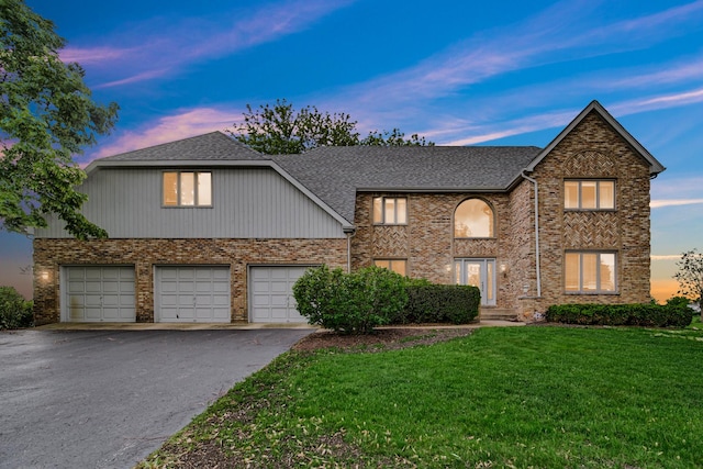 24161 Brancaster Dr, Naperville, IL 60564 - traditional home featuring driveway, a lawn, roof with shingles, brick siding, and an attached garage