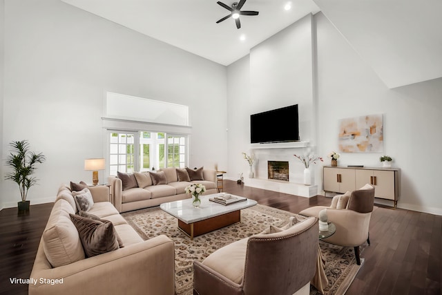 24161 Brancaster Dr, Naperville, IL 60564 - living area with high vaulted ceiling, a ceiling fan, wood finished floors, recessed lighting, and a fireplace with raised hearth