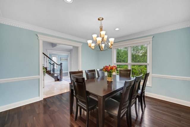 24161 Brancaster Dr, Naperville, IL 60564 - dining area with a chandelier, stairs, crown molding, baseboards, and dark wood-style flooring