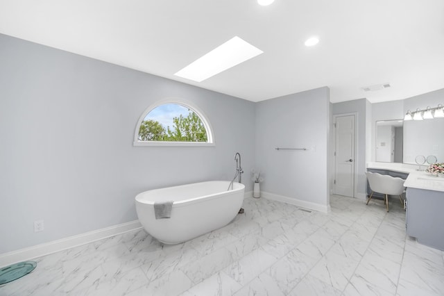 24161 Brancaster Dr, Naperville, IL 60564 - full bath with a soaking tub, vanity, marble finish floors, a skylight, and baseboards