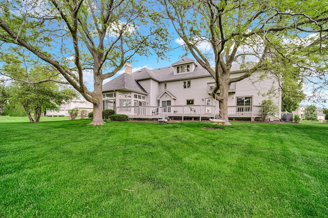 24161 Brancaster Dr, Naperville, IL 60564 - back of house with a lawn, a deck, a chimney, and a shingled roof