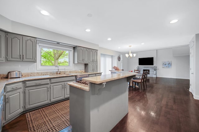 24161 Brancaster Dr, Naperville, IL 60564 - kitchen featuring gray cabinetry, a sink, a chandelier, a kitchen island, and recessed lighting