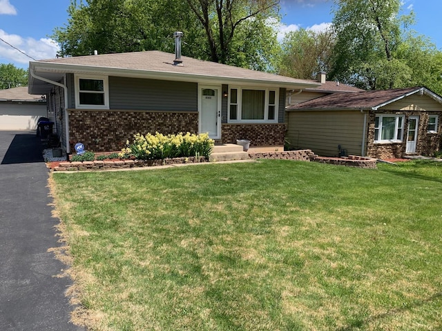 10100 W Chaplin Ave, Beach Park, IL 60087 - ranch-style house featuring a front yard and brick siding