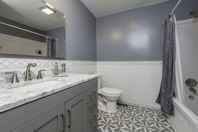10100 W Chaplin Ave, Beach Park, IL 60087 - bathroom with vanity, a wainscoted wall, shower / tub combo with curtain, and tile walls