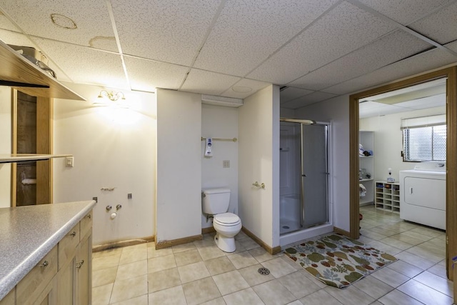 10100 W Chaplin Ave, Beach Park, IL 60087 - bathroom with washer / clothes dryer, a shower stall, vanity, tile patterned flooring, and a paneled ceiling