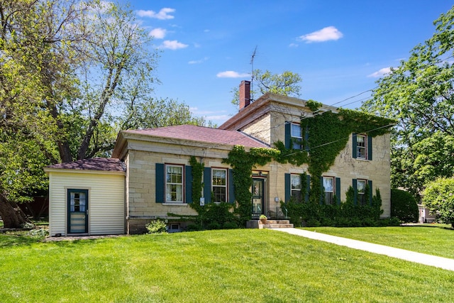 1006 S Jefferson St, Lockport, IL 60441 - italianate house with a front yard and a chimney