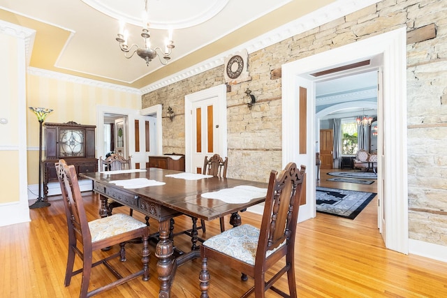 1006 S Jefferson St, Lockport, IL 60441 - dining space with a chandelier, light wood-type flooring, arched walkways, and ornamental molding