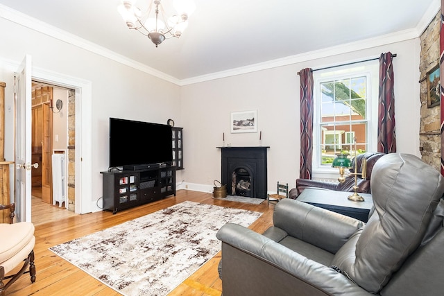 1006 S Jefferson St, Lockport, IL 60441 - living room featuring ornamental molding, wood finished floors, a fireplace with flush hearth, and a chandelier