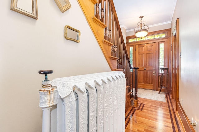 1006 S Jefferson St, Lockport, IL 60441 - entrance foyer with light wood-type flooring, ornamental molding, stairway, and baseboards