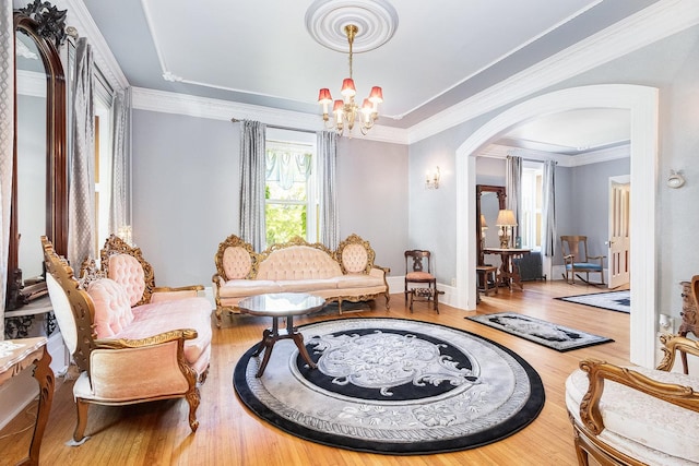 1006 S Jefferson St, Lockport, IL 60441 - living area featuring a chandelier, arched walkways, wood finished floors, ornamental molding, and baseboards