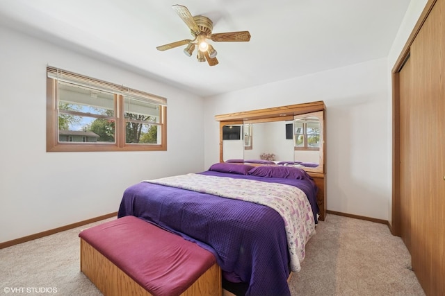 1713 Meadow Ln, Mchenry, IL 60050 - bedroom featuring light carpet, a closet, baseboards, and ceiling fan