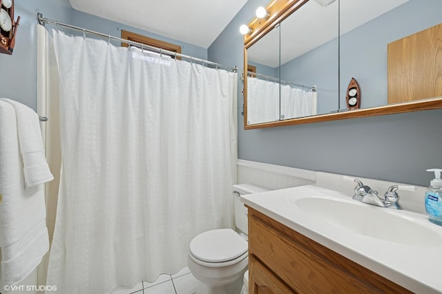 1713 Meadow Ln, Mchenry, IL 60050 - full bathroom featuring toilet, vanity, wainscoting, and tile patterned flooring