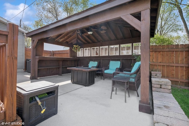 1713 Meadow Ln, Mchenry, IL 60050 - fenced backyard featuring a gazebo, ceiling fan, a patio area, and an outdoor hangout area