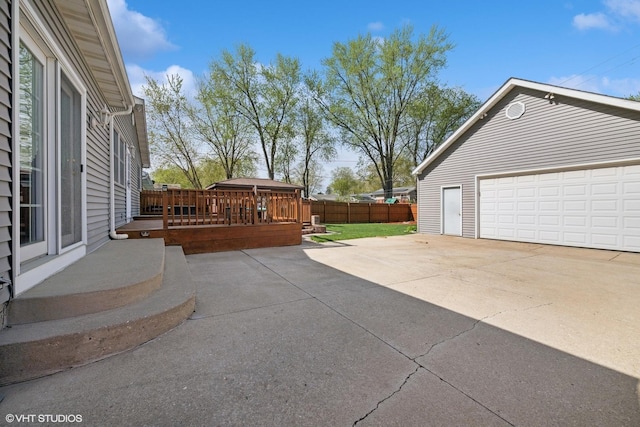 1713 Meadow Ln, Mchenry, IL 60050 - view of patio with a detached garage and a deck