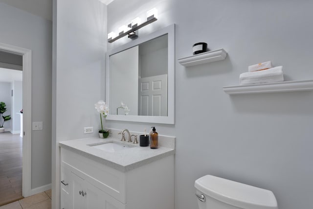 1111 S Wabash Ave Unit 1604, Chicago, IL 60605 - bathroom with toilet, vanity, baseboards, and tile patterned floors