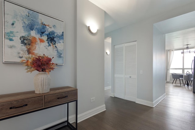 1111 S Wabash Ave Unit 1604, Chicago, IL 60605 - corridor with dark wood finished floors, baseboards, and a chandelier