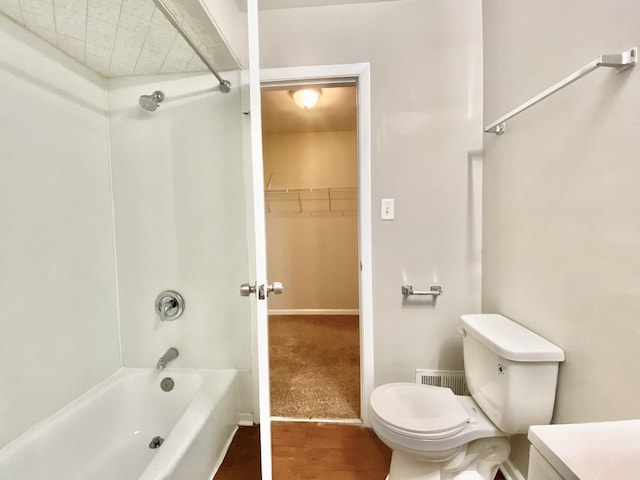 22962 Bruce Dr, Richton Park, IL 60471 - bathroom with toilet, wood finished floors, vanity, shower / bathtub combination, and a walk in closet