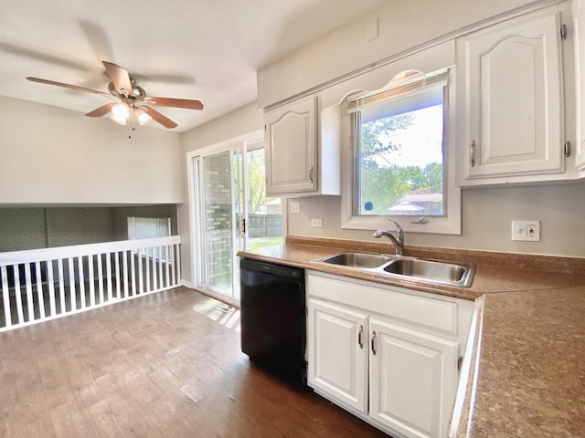 22962 Bruce Dr, Richton Park, IL 60471 - kitchen with black dishwasher, a sink, a ceiling fan, and white cabinetry