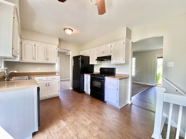 22962 Bruce Dr, Richton Park, IL 60471 - kitchen with black appliances, a sink, ceiling fan, under cabinet range hood, and white cabinets