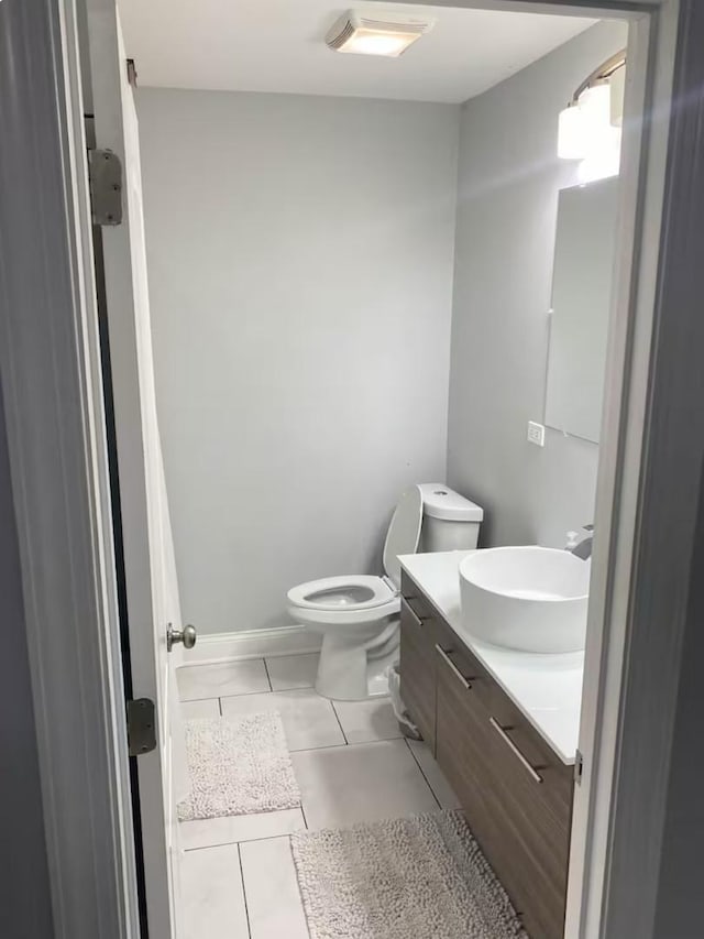 4148 S King Dr Unit G3, Chicago, IL 60653 - bathroom with vanity, tile patterned flooring, and toilet