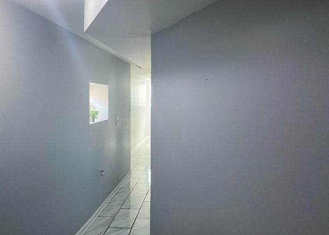 4148 S King Dr Unit G3, Chicago, IL 60653 - hallway featuring baseboards and light marble finish flooring