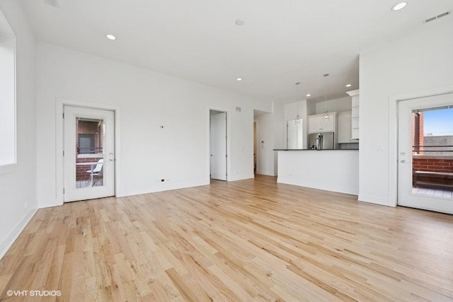 2505 W Potomac Ave Unit 3W, Chicago, IL 60622 - unfurnished living room featuring light wood-type flooring, recessed lighting, and baseboards