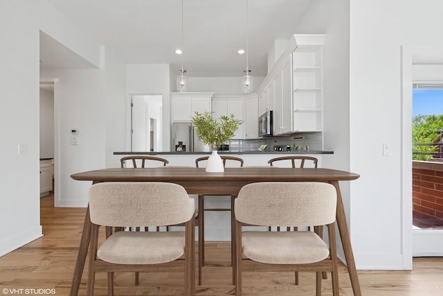 2505 W Potomac Ave Unit 3W, Chicago, IL 60622 - kitchen featuring stainless steel appliances, decorative backsplash, white cabinetry, open shelves, and light wood-style flooring
