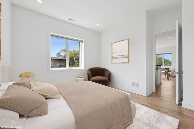 2505 W Potomac Ave Unit 3W, Chicago, IL 60622 - bedroom with light wood-type flooring, recessed lighting, and baseboards