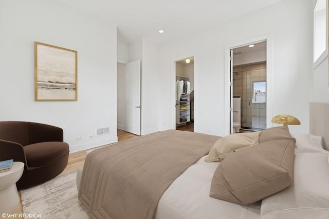 2505 W Potomac Ave Unit 3W, Chicago, IL 60622 - bedroom with a spacious closet, light wood finished floors, recessed lighting, baseboards, and a closet