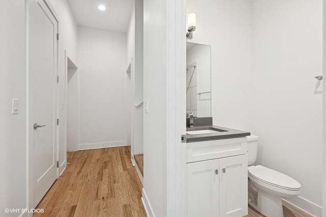 2505 W Potomac Ave Unit 3W, Chicago, IL 60622 - bathroom featuring vanity, toilet, wood finished floors, and baseboards