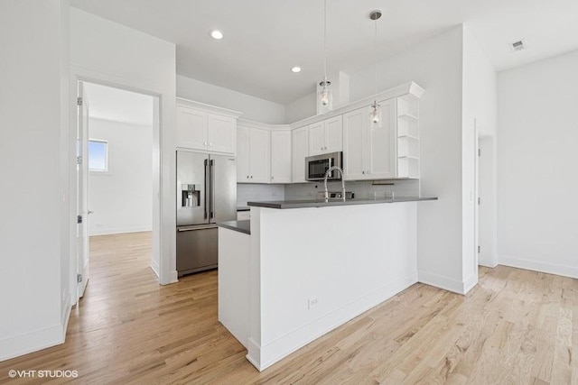 2505 W Potomac Ave Unit 3W, Chicago, IL 60622 - kitchen with stainless steel appliances, open shelves, white cabinetry, dark countertops, and decorative backsplash