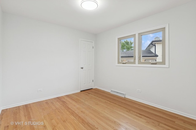3838 Emerson Dr, Schiller Park, IL 60176 - spare room with baseboards and light wood-style flooring
