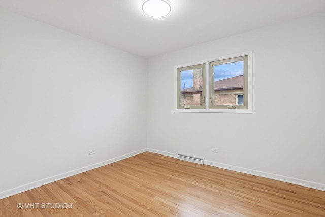 3838 Emerson Dr, Schiller Park, IL 60176 - spare room with baseboards and light wood-type flooring