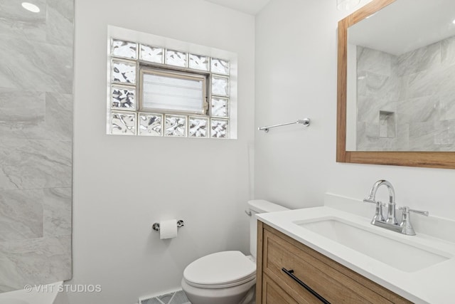 3838 Emerson Dr, Schiller Park, IL 60176 - bathroom featuring vanity, toilet, and a shower