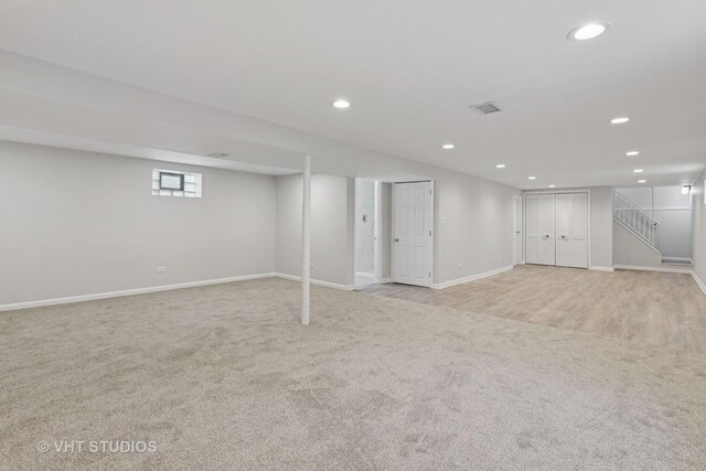 3838 Emerson Dr, Schiller Park, IL 60176 - basement featuring light carpet, recessed lighting, baseboards, and stairway