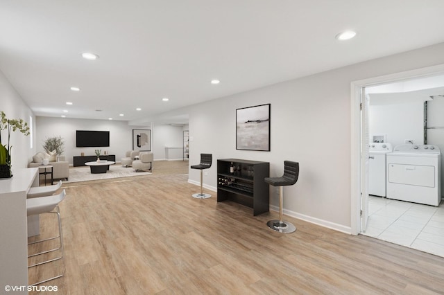 3838 Emerson Dr, Schiller Park, IL 60176 - living area with washer and dryer, light wood-style flooring, recessed lighting, and baseboards