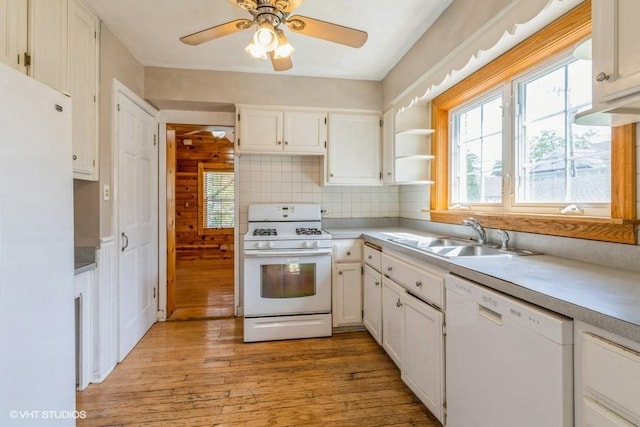 2140 Cedar Ct, Glenview, IL 60025 - kitchen with white appliances, a sink, light wood finished floors, and healthy amount of natural light