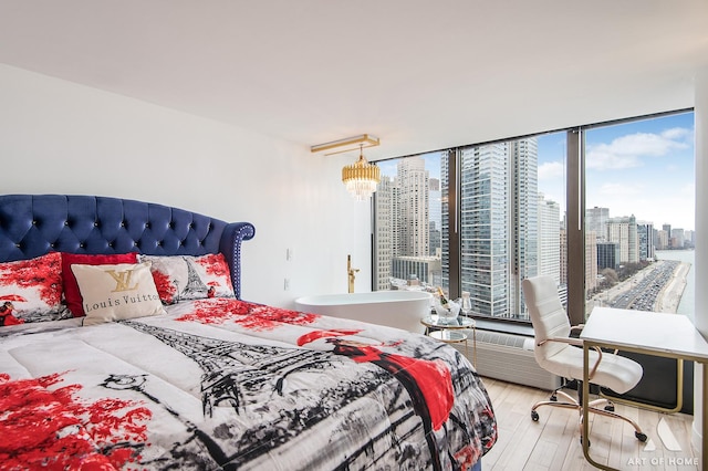 505 N Lake Shore Dr Unit 2017, Chicago, IL 60611 - bedroom with wood finished floors, a view of skyline, and multiple windows