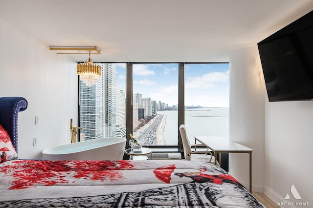505 N Lake Shore Dr Unit 2017, Chicago, IL 60611 - bedroom with wood finished floors, baseboards, and a chandelier