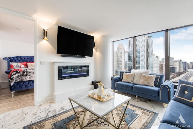 505 N Lake Shore Dr Unit 2017, Chicago, IL 60611 - living area with a fireplace, light marble finish flooring, and baseboards