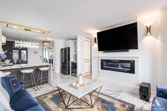 505 N Lake Shore Dr Unit 2017, Chicago, IL 60611 - living area featuring beverage cooler, light marble finish flooring, a glass covered fireplace, and recessed lighting