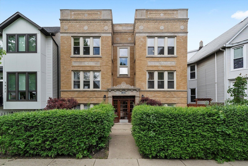 3826 N Troy St Unit 2N, Chicago, IL 60618 - view of front of home featuring brick siding