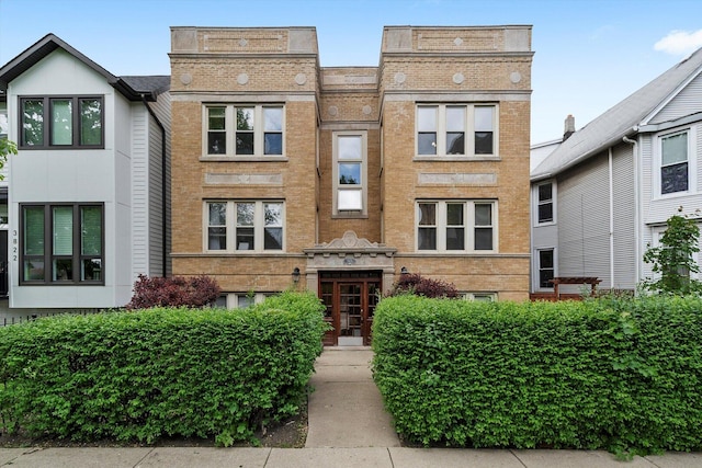 view of front of home featuring brick siding